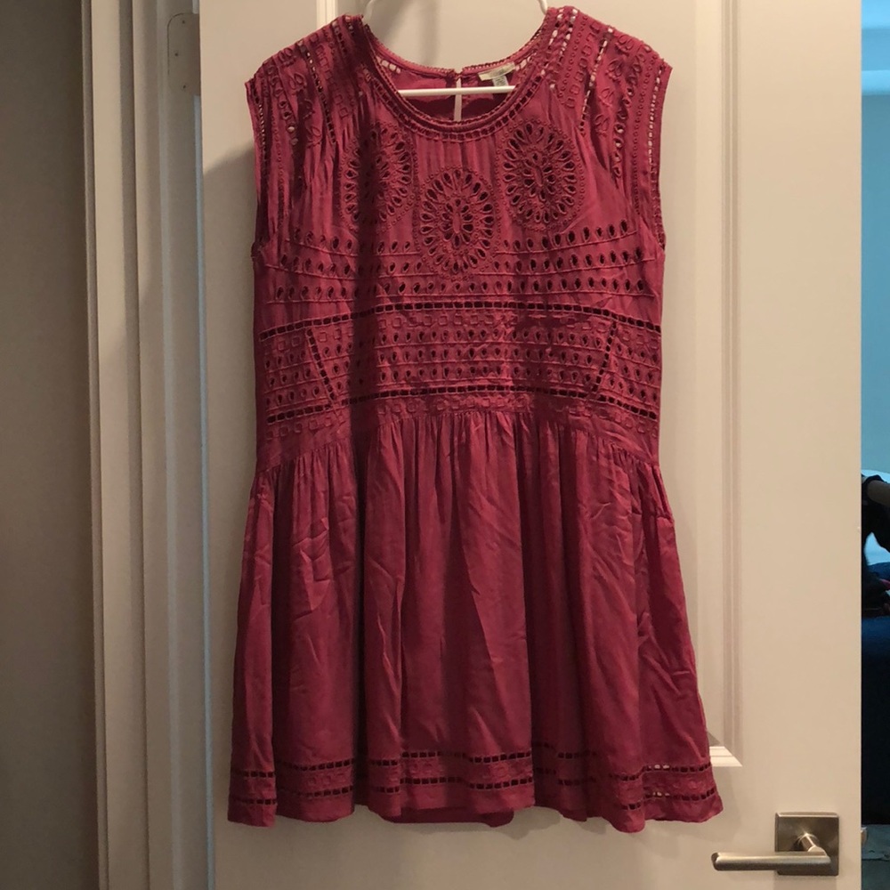 A beautiful mauve dress with detailing.